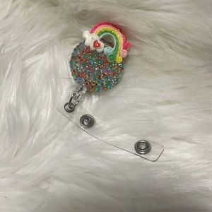 Rainbow colored retractable badge reel. This is a handmade item.